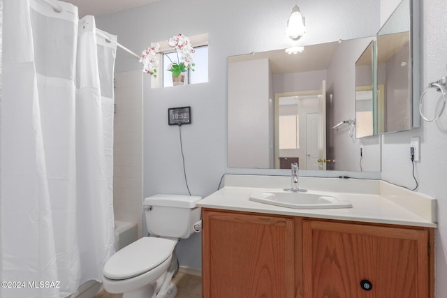 full bathroom with vanity, shower / bath combination with curtain, and toilet