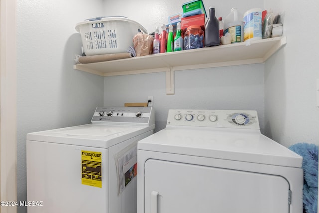 washroom featuring washer and clothes dryer