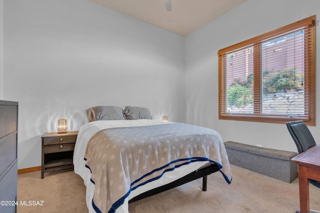 bedroom featuring ceiling fan and light carpet