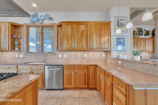 kitchen with pendant lighting, dishwasher, decorative backsplash, and sink