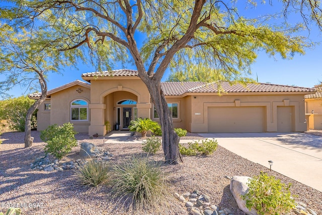 mediterranean / spanish-style home featuring a garage