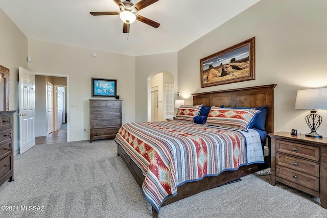 bedroom with ceiling fan and light colored carpet