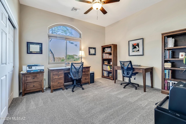 home office featuring light colored carpet and ceiling fan