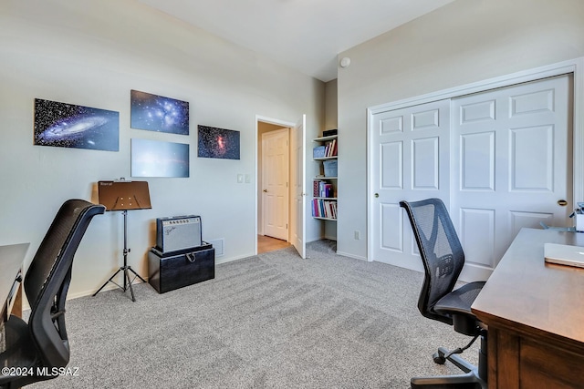 office with light colored carpet and built in features