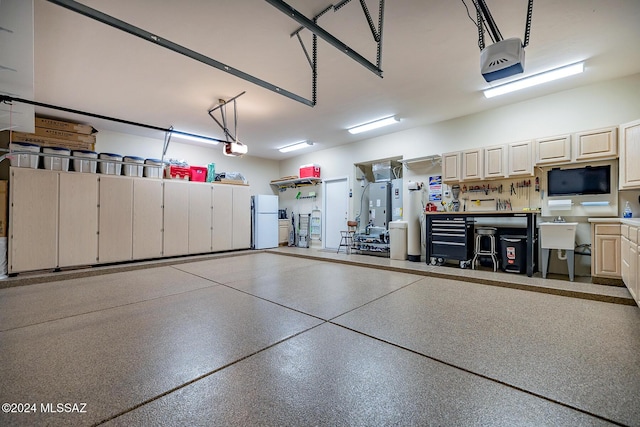 garage featuring a garage door opener and white refrigerator