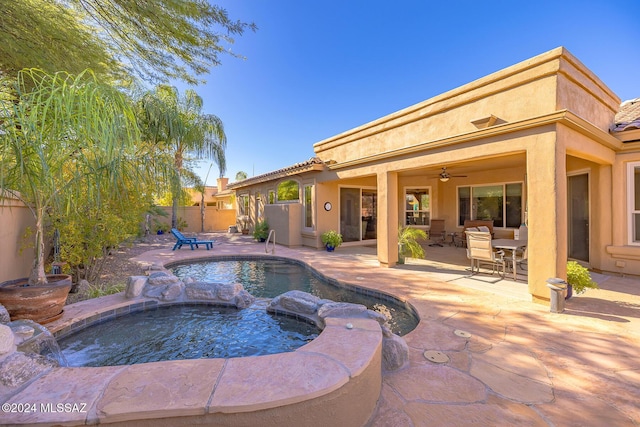 view of swimming pool with an in ground hot tub, a patio, and ceiling fan