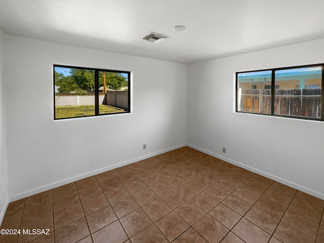 view of tiled spare room