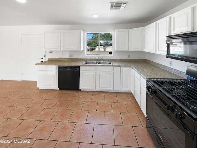 kitchen with white cabinets, sink, and black appliances