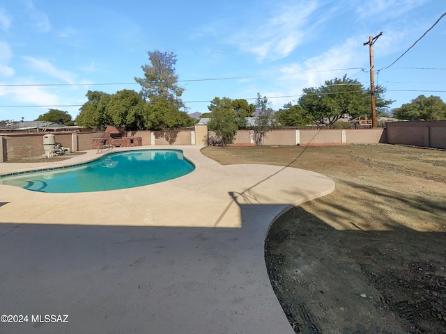 view of swimming pool with a patio