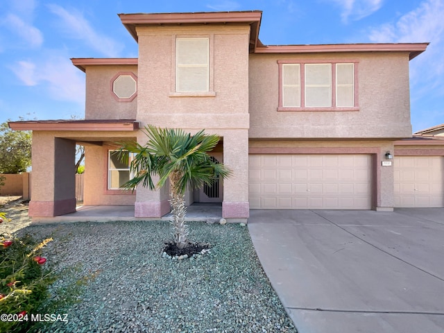 front facade with a garage