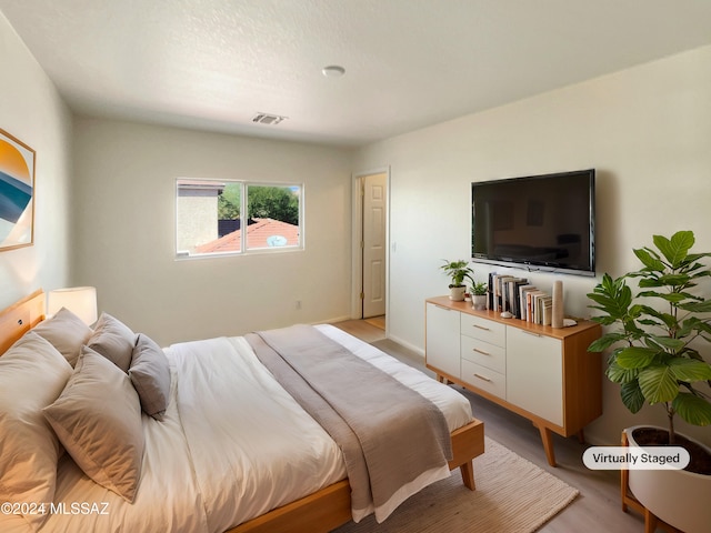 bedroom featuring light wood-type flooring