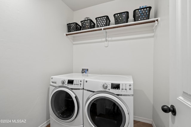 laundry area with washing machine and clothes dryer