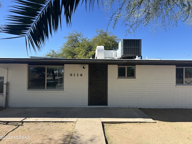 single story home with central air condition unit