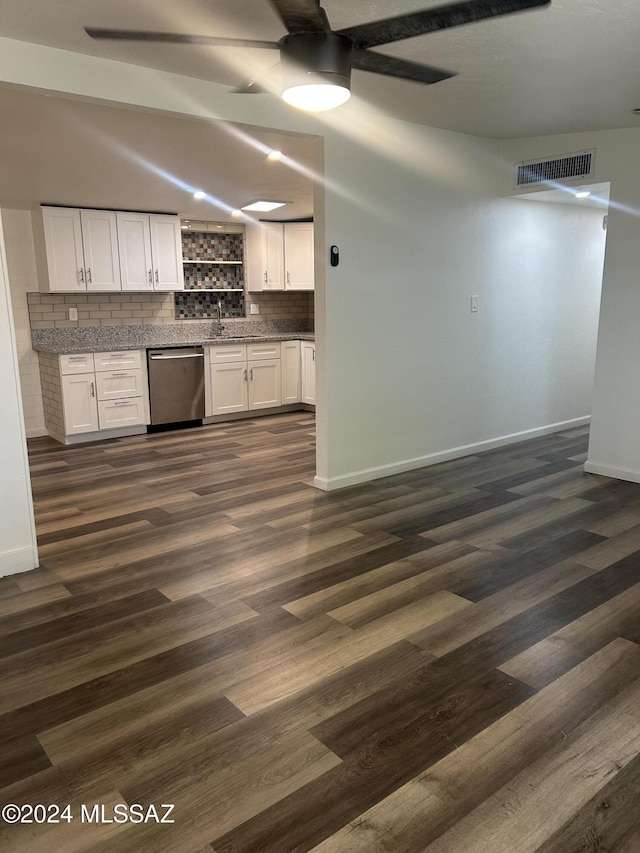 kitchen featuring dishwasher, sink, tasteful backsplash, dark hardwood / wood-style flooring, and white cabinetry