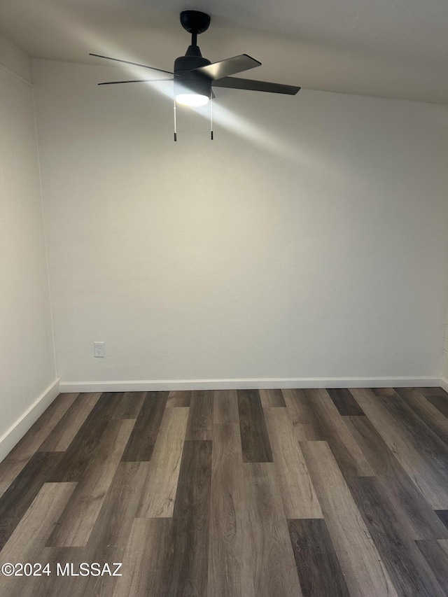 unfurnished room featuring ceiling fan and dark hardwood / wood-style flooring