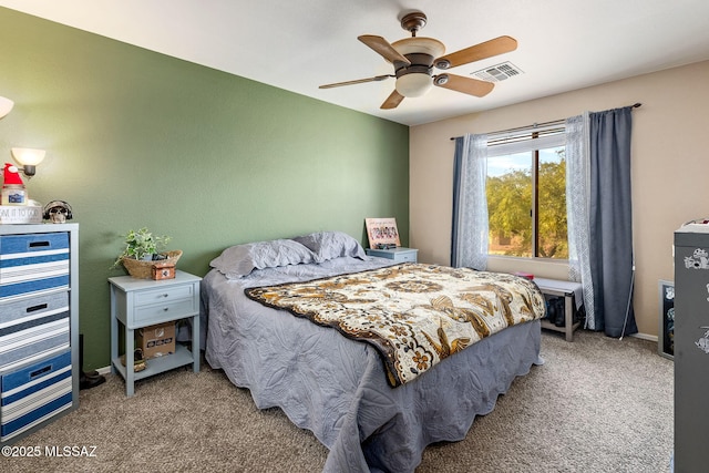 carpeted bedroom featuring a ceiling fan and baseboards