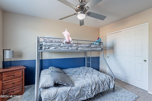 bedroom with carpet, ceiling fan, and a closet