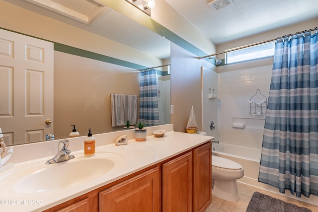 full bathroom with tile patterned flooring, a textured ceiling, toilet, vanity, and shower / tub combo