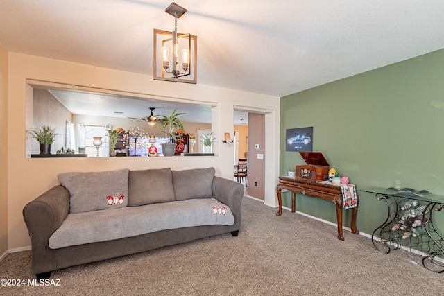 carpeted living room with an inviting chandelier