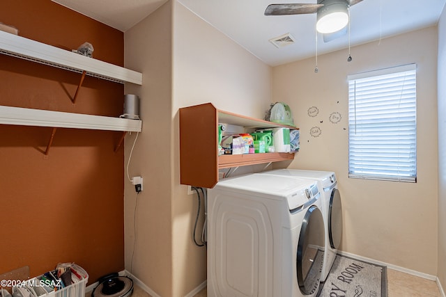 clothes washing area featuring ceiling fan, tile patterned flooring, and washer and dryer