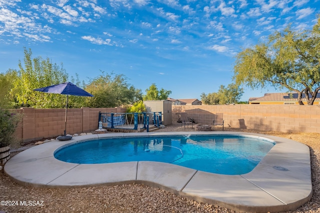 view of pool featuring a fenced backyard