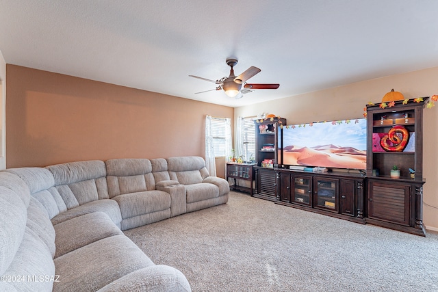 living room featuring ceiling fan and light carpet