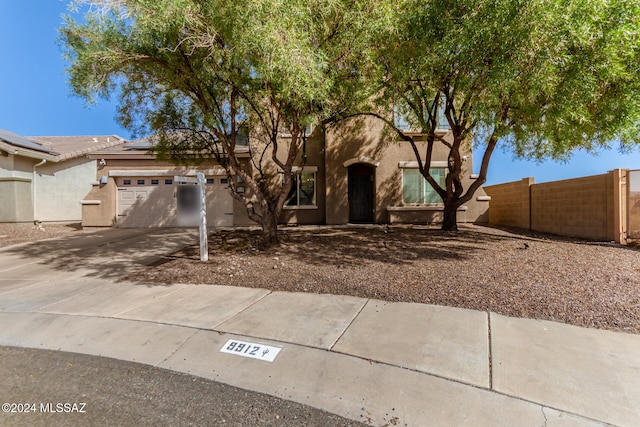 view of front of property featuring a garage