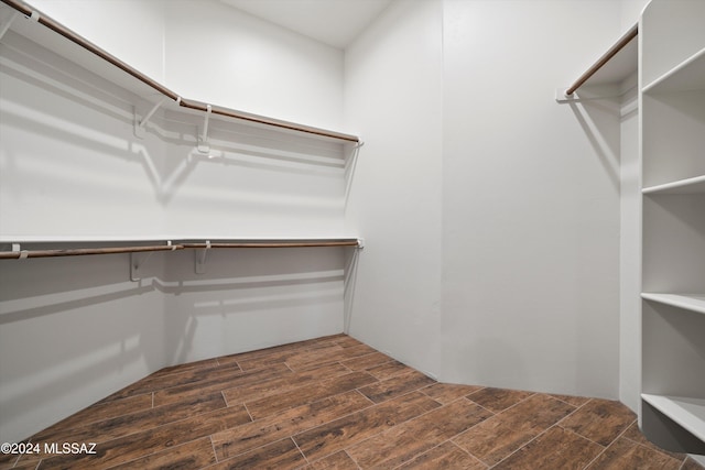 walk in closet featuring wood finished floors