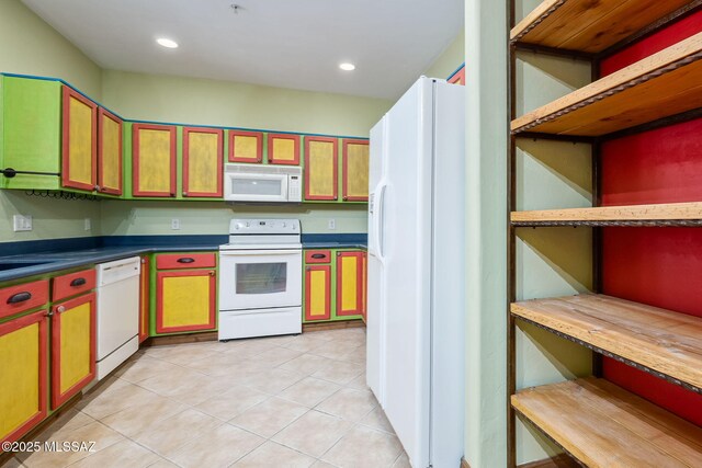 kitchen with dishwasher, light tile patterned flooring, and sink