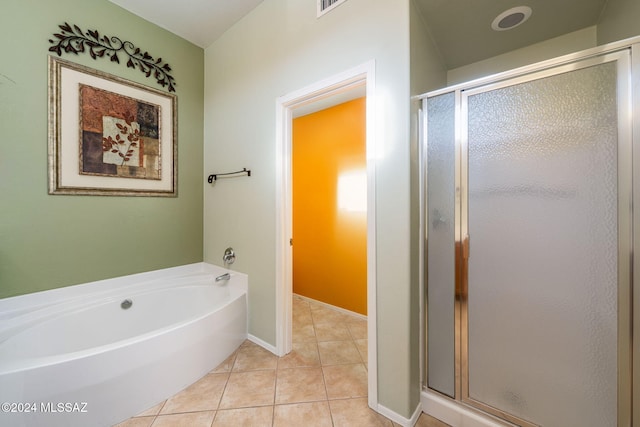 bathroom featuring shower with separate bathtub and tile patterned floors