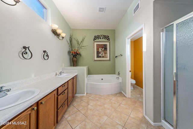 full bathroom with tile patterned floors, vanity, independent shower and bath, and toilet