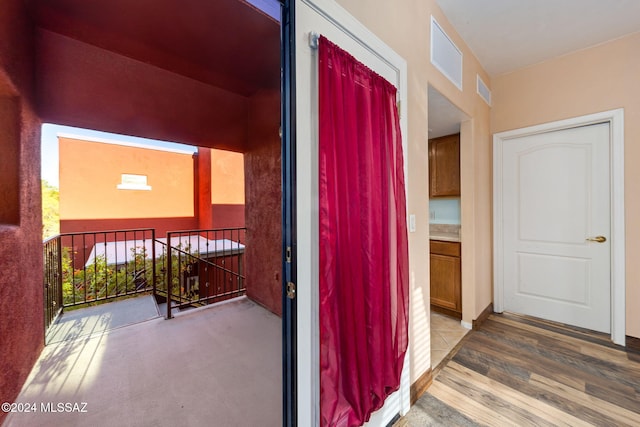 hallway featuring hardwood / wood-style floors