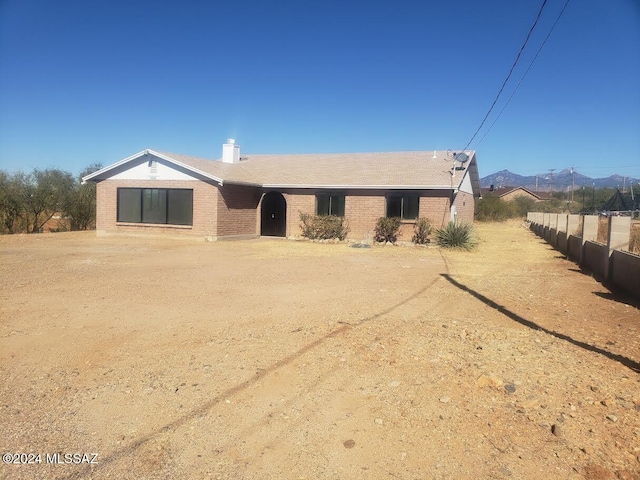 view of front of home featuring a mountain view