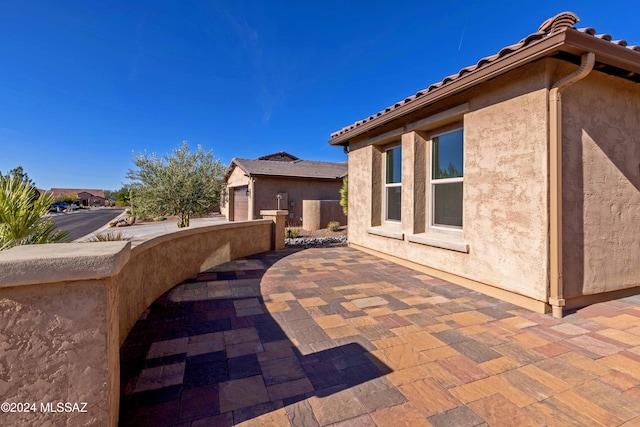 view of patio / terrace with a garage