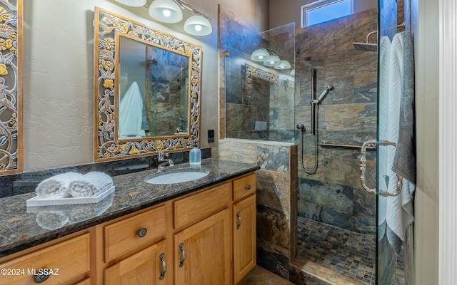 bathroom featuring vanity and a tile shower