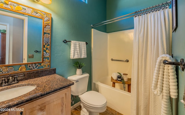 full bathroom with tile patterned floors, vanity, toilet, and shower / bath combo with shower curtain