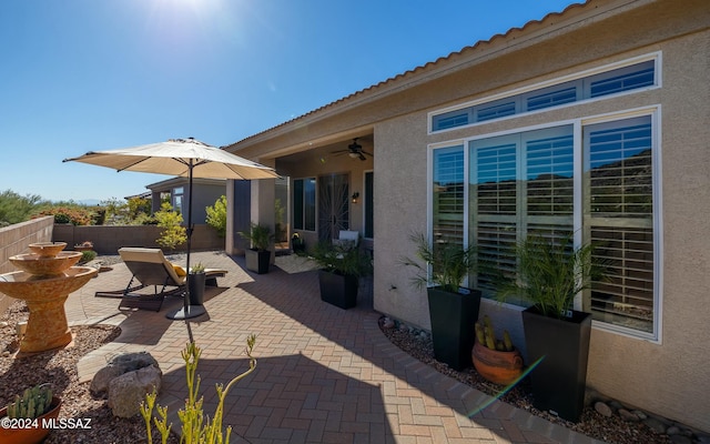 view of patio / terrace featuring ceiling fan