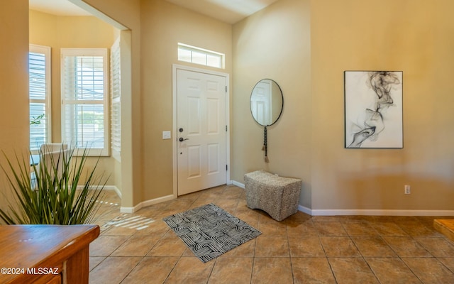 foyer featuring light tile patterned floors