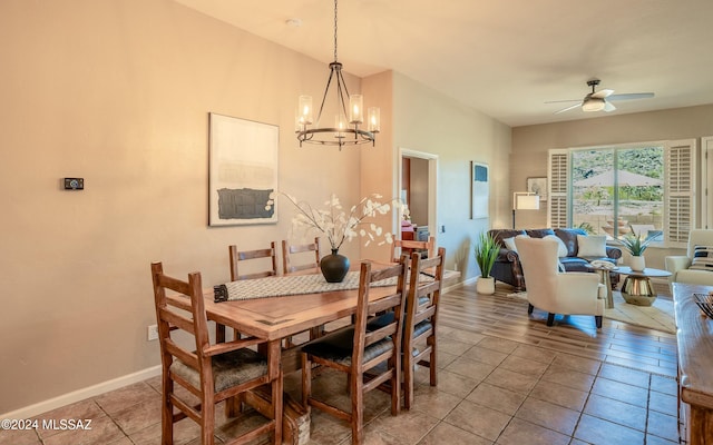 dining area with ceiling fan with notable chandelier and light wood-type flooring