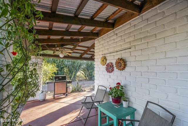 view of patio / terrace with area for grilling and ceiling fan