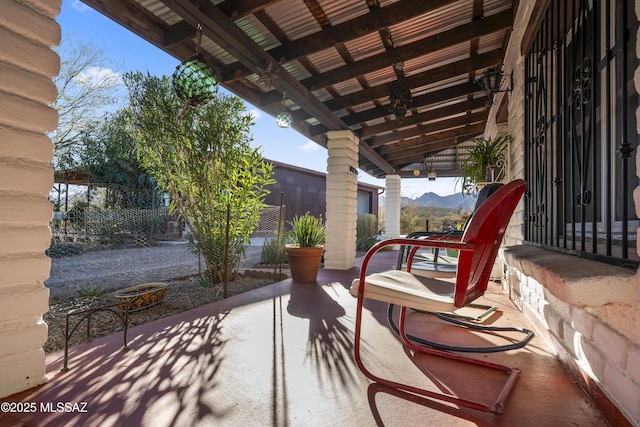 view of patio / terrace featuring a mountain view
