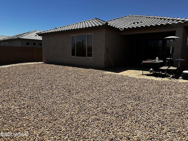 11918 N Raphael Way, Tucson, AZ 85742 - rear view of house with stucco siding, a tile roof, and a patio area