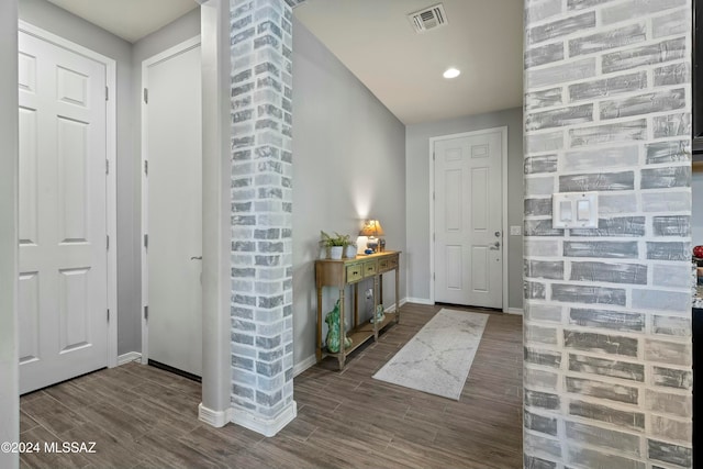 foyer entrance featuring dark wood-type flooring