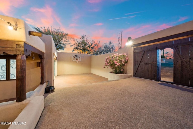 view of patio terrace at dusk