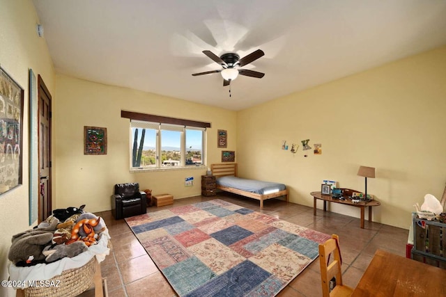 bedroom with tile patterned flooring and ceiling fan