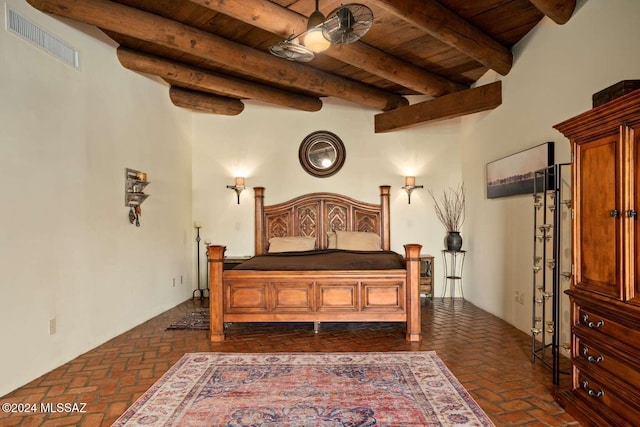 bedroom with beam ceiling, wooden ceiling, and a high ceiling