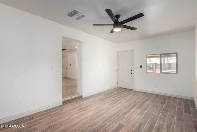 unfurnished room featuring ceiling fan and light wood-type flooring