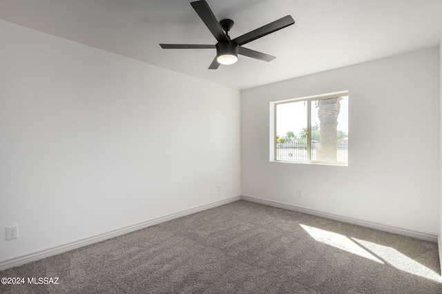 spare room with carpet and ceiling fan