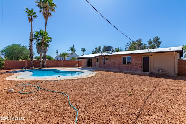 view of pool featuring a patio area and a diving board