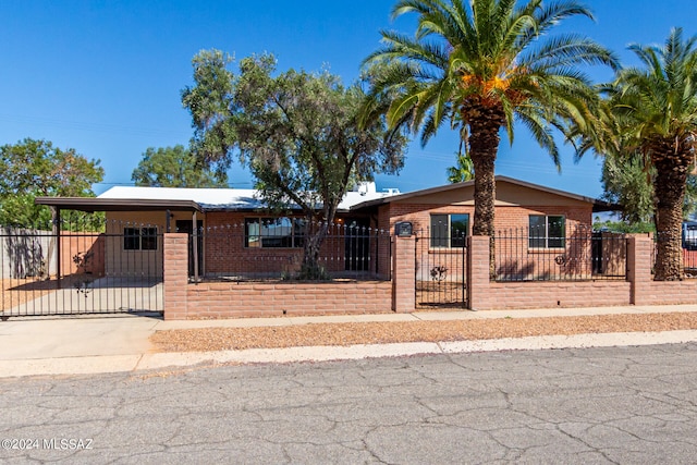 ranch-style house with a carport